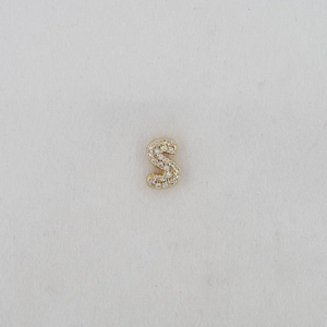 Macro shot of letter S bubble pendant with pavé set cubic zirconia in gold finish