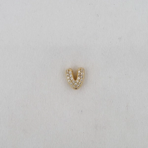 Detail of gold letter V pendant featuring micro-pave white cubic zirconia stones