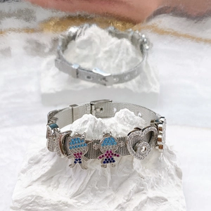 Silver mesh stainless steel bracelet with boy girl charms and heart pendant in zicron stones