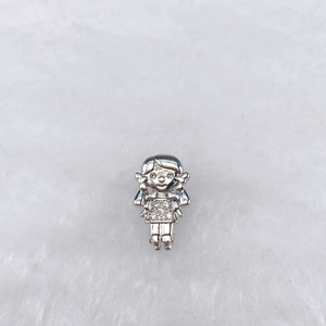 Detail of a polished silver girl charm with pigtails for stainless steel watchband