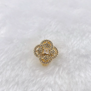 Detail of clover jewelry with gold plating, micro-pave crystals and square center stone
