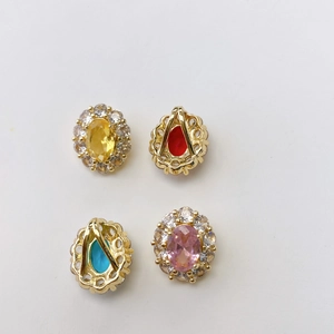 Detailed view of vintage oval birthstone pendants with gold plating and cubic zirconia