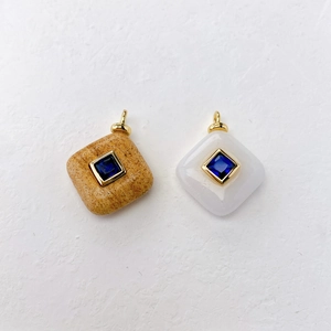 Elegant gold-plated square stone pendants with blue zircon inlay on white background