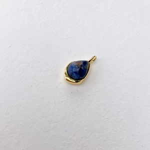 Close-up of teardrop lapis lazuli pendant with gold plated bezel setting for necklaces