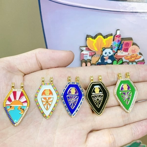 Handheld vintage gold-plated tarot pendants with colorful enamel Hamsa hand and sun wave patterns