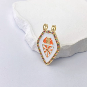Detail of gold-plated tarot pendant featuring hand of fatima and colorful zircon stones