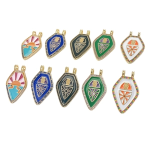 Set of 10 vintage gold-plated tarot pendants with Hamsa Hand and sunburst enamel patterns