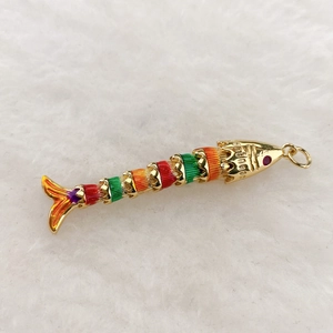 Articulated tropical fish pendant in gold with colorful enamel and sparkling red gem eyes