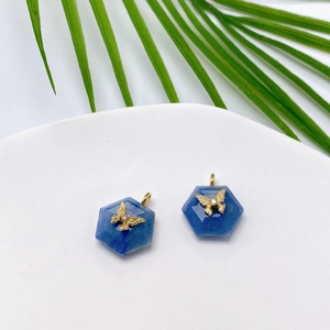 Blue hexagonal natural stone pendants with gold butterfly inlay and crystal details