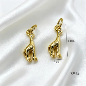 Detailed macro view of 14mm gold giraffe pendant charm with size and weight dimensions