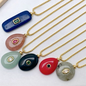 Six assorted natural stone necklaces with gold chains including malachite and rose quartz pendants