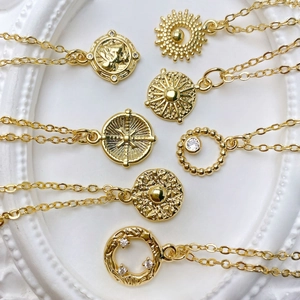 Set of six vintage gold plated sun and coin charms for elegant necklaces and bracelets