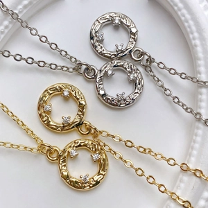 Exquisite sun-shaped pendant necklace with textured circle and three zircon accents