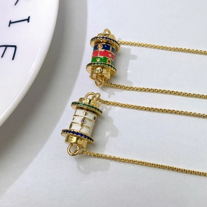 Golden cylinder necklace with colorful enamel patterns and sparkling gem inlay for women