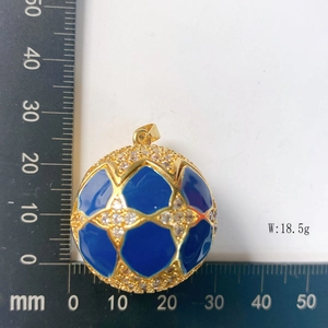 Detail of blue enamel golden sphere pendant measuring 30mm diameter and 18.5g weight