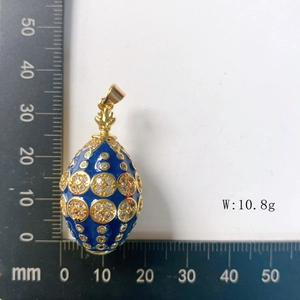 Detailed measurement of blue enamel egg pendant showing dimensions of 35mm and 10.8g weight