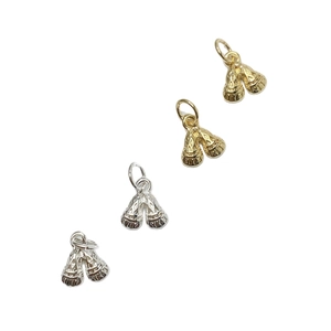 Set of four gold and silver boxing glove pendants with textured geometric embossing