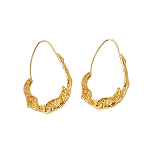 Vintage irregular golden metal drop earrings with lava texture and minimalist style