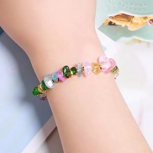 Handmade bohemian bracelet with colorful irregular crystals and gold metal spacers