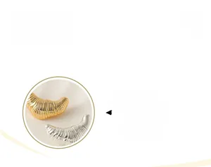 Detail display showing textured gold and silver croissant metal brooches with metallic finish