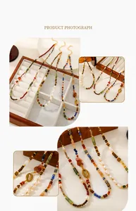 Detail of beaded necklaces with tiger eye, freshwater pearls and lapis lazuli beads