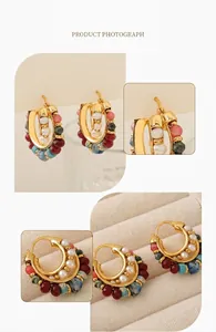 Detailed close-up of French vintage C-shape earrings with colorful beads and white pearls