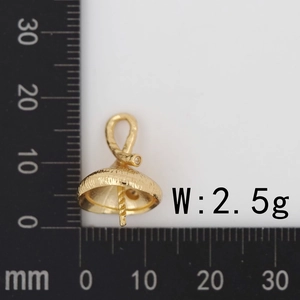 Detail view of 13mm gold umbrella jewelry clasp with white zircon and size ruler