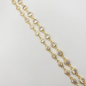 Detail of 4mm gold plated zircon chain featuring bezel-set round sparkling crystals