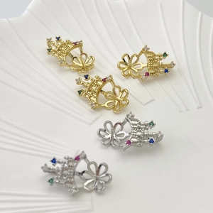 Detailed view of crown jewelry settings with colorful zircons in gold and silver plating