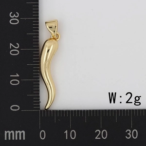 Macro shot of 28mm polished chili pendant on metric scale weighing 2 grams