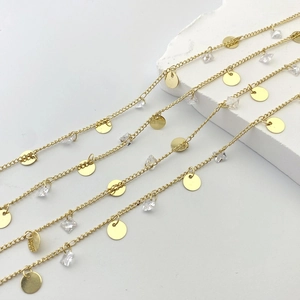Layered gold chain necklace with round sequin pendants and sparkling clear zircon crystals