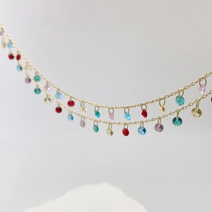 Close-up of double-layer gold plated chain with colorful round zircon stone charms