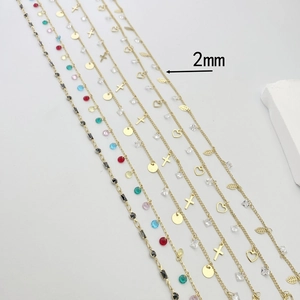 Detailed view of 2mm gold-plated copper chains with heart and leaf zircon charms