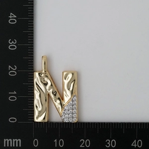 Size detail of golden letter N pendant with zircon showing height and width measurements