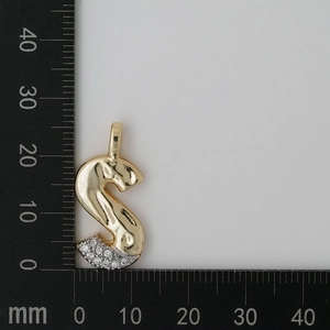 Macro detail of a 30mm golden letter S pendant with zircon stones and measurement scale