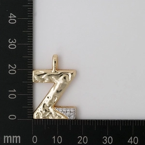 Detailed measurement of gold letter Z pendant with hammered texture and cubic zirconia stones