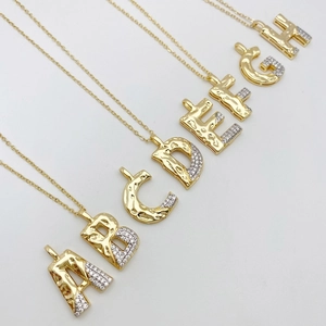 Fashionable gold plated letter pendant necklace with zircon stones and lava texture design