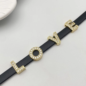 Black leather strap bracelet with gold LOVE charms and micro-pave white cubic zirconia
