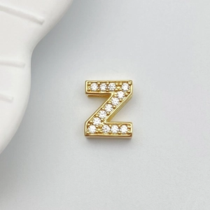 Detail of gold letter Z pendant with micro paved cubic zirconia for DIY jewelry
