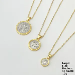 Three gold and silver St. Benedict medal necklaces in large, medium, and small sizes