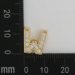 Detailed dimension shot showing golden W-shaped charm with white zirconias, size 10x12mm