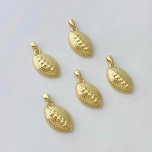 Macro detail of five gold-plated American football charms with textured surface and top rings