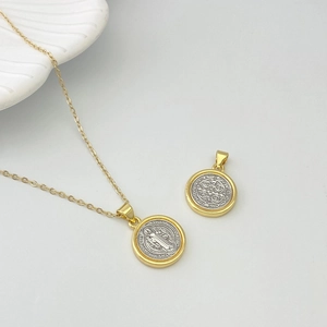 Saint Benedict medal necklace with gold chain and two-tone silver relief pendant