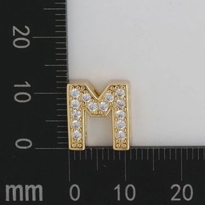 Detailed scale view of 12x11mm gold letter M charm with micro-set white cubic zirconia