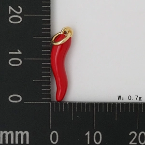 Macro detail of red chili pendant necklace showing 18mm size on ruler and 0.7g weight