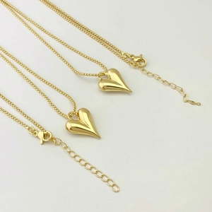 Polished golden heart pendant necklace set with elegant box chain and lobster clasp closure