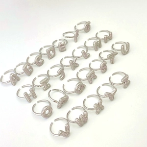 Macro view of all 26 initial letters rings with silver plating and colorful zircon stones