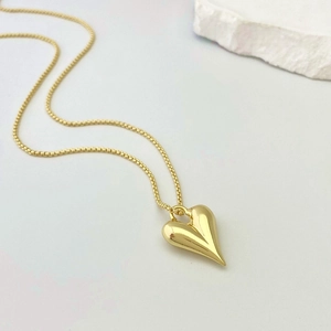 Elegant gold heart pendant necklace with polished finish and delicate box chain