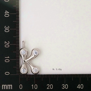 Detailed size measurement of silver letter K pendant with cubic zirconia inlay and 3.45g weight