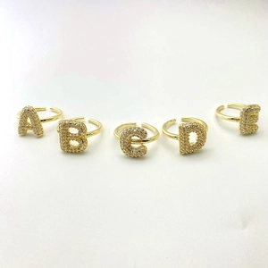 Five-piece gold adjustable letter rings set with micro-pave cubic zirconia crystals
